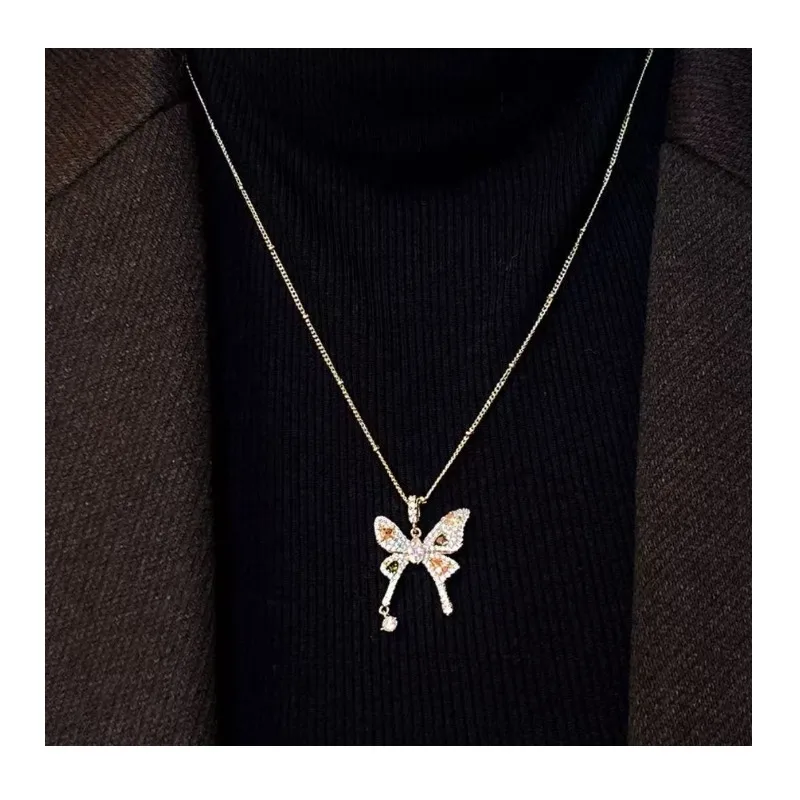 Slightly Inlaid with Zirconium Bow Pendant Necklace Women's New Autumn and Winter Accessories Light Luxury Niche Earrings Sweate
Slightly Inlaid with Zirconium Bow Pendant Necklace Women's New Autumn and Winter Accessories Light Luxury Niche Earrings Sweate