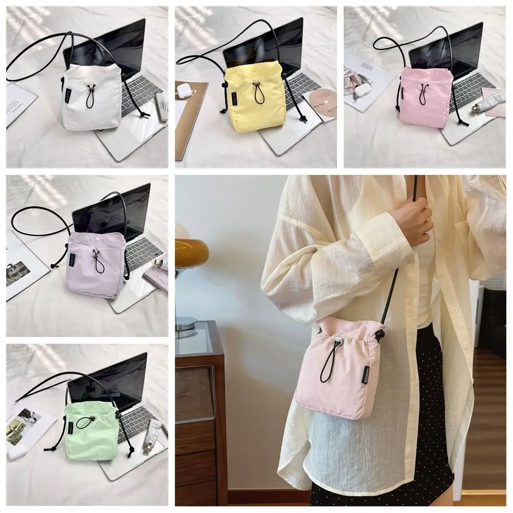 Sweet Korean Style Drawstring Canvas Bag Crossbody Bag Purse Nylon Shoulder Bag Solid Color Wallet Bags Mobile Phone Bag Girls
Sweet Korean Style Drawstring Canvas Bag Crossbody Bag Purse Nylon Shoulder Bag Solid Color Wallet Bags Mobile Phone Bag Girls