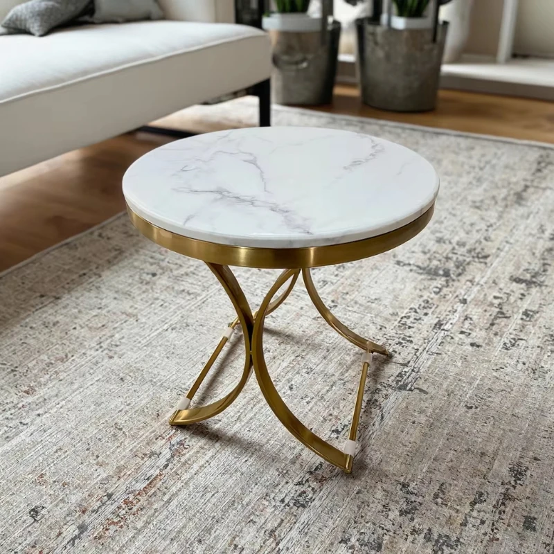 Modern round coffee table with marble top and metal frame
Modern round coffee table with marble top and metal frame