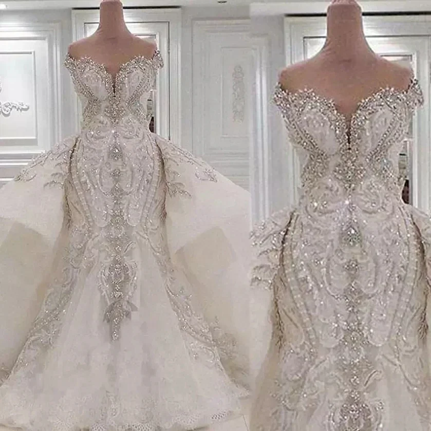 Customized Mermaid Crystal Luxury Wedding Dresses With Overskirts Lace Ruched Sparkle Rhinstone Bridal Gowns Dubai Vestidos De N
Customized Mermaid Crystal Luxury Wedding Dresses With Overskirts Lace Ruched Sparkle Rhinstone Bridal Gowns Dubai Vestidos De N