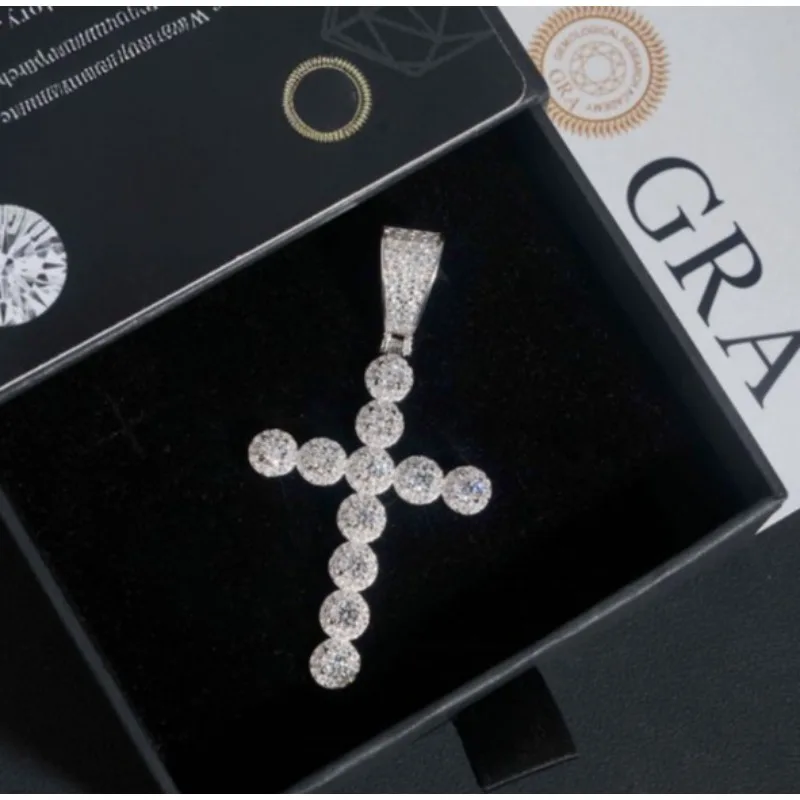 Cross Pendant: 925 sterling silver set with moissanite. GRA-certified, this piece embodies a unique, street-style aesthetic.
Cross Pendant: 925 sterling silver set with moissanite. GRA-certified, this piece embodies a unique, street-style aesthetic.