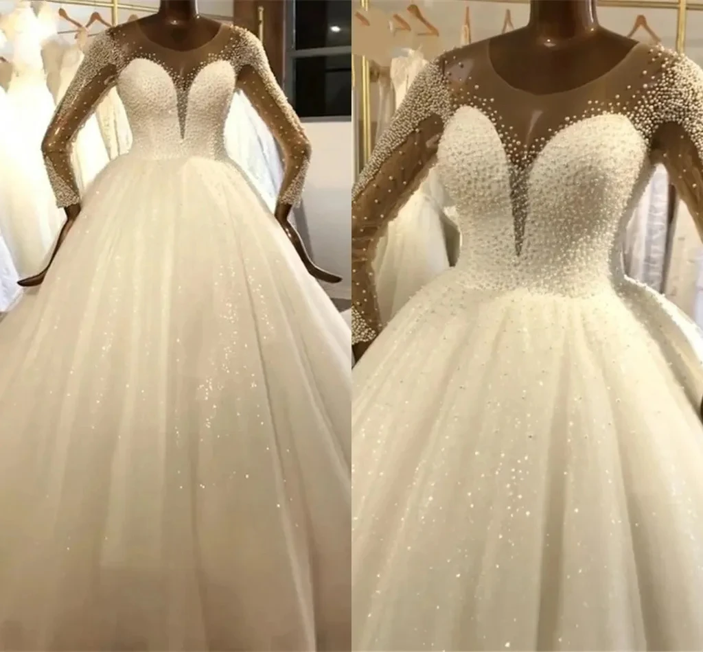 Customized Scoop Neck Sparkly Pearls Bead Ballgown Wedding Dress Vestidos De Novia Illusion Back Long Sleeves Bridal Dress
Customized Scoop Neck Sparkly Pearls Bead Ballgown Wedding Dress Vestidos De Novia Illusion Back Long Sleeves Bridal Dress