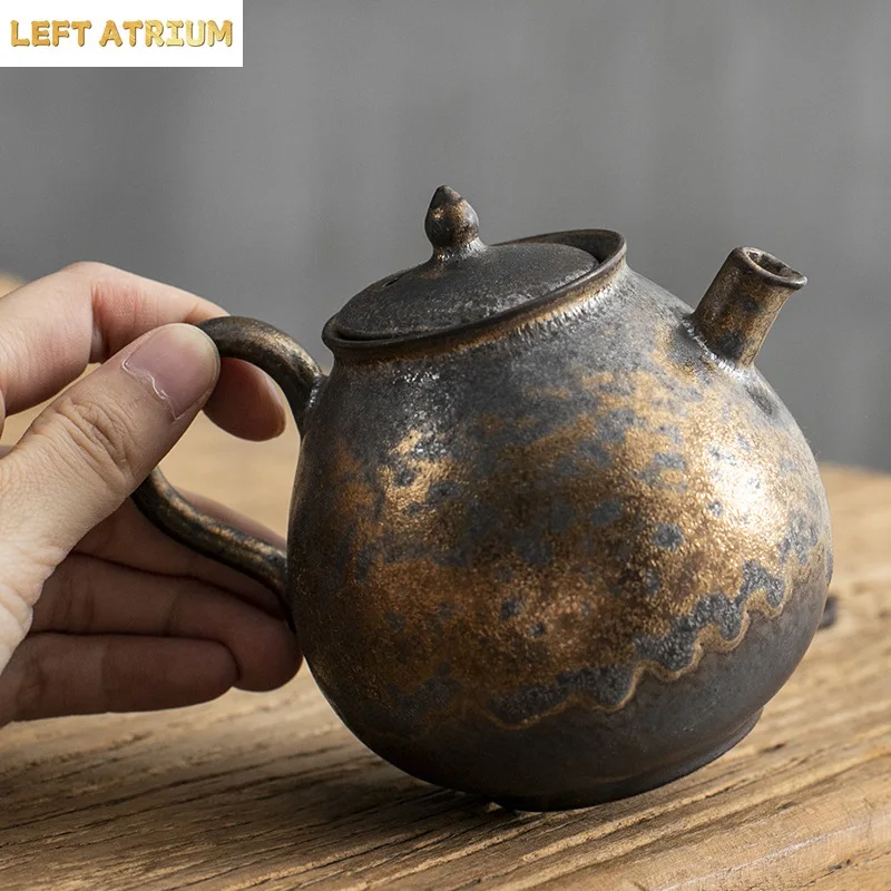 Pure hand-made retro gold rust glazed teapot single pot coarse pottery kung fu tea set ceramic home gift tea maker
Pure hand-made retro gold rust glazed teapot single pot coarse pottery kung fu tea set ceramic home gift tea maker