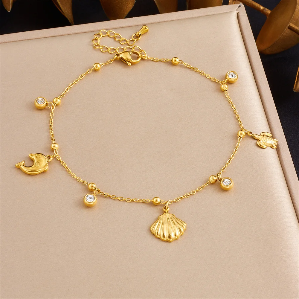 Gold Tone 316L Stainless Steel Ocean Charm Bracelet with Dolphin, Turtle & Shell Pendants for Women
Gold Tone 316L Stainless Steel Ocean Charm Bracelet with Dolphin, Turtle & Shell Pendants for Women