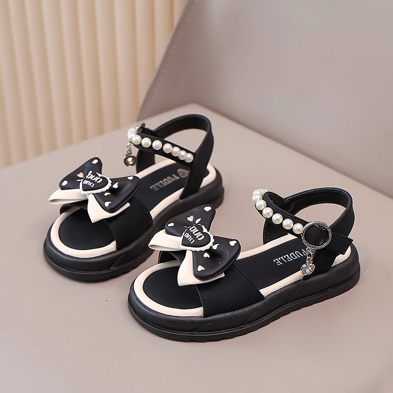 Детские сандалии для девочек, летняя модная мягкая удобная нескользящая пляжная обувь принцессы на плоской подошве с милым бантом, модные детские сандалии
Детские сандалии для девочек, летняя модная мягкая удобная нескользящая пляжная обувь принцессы на плоской подошве с милым бантом, модные детские сандалии