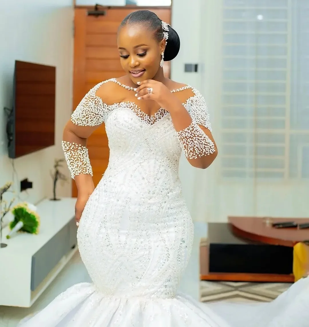 High Quality Mermaid African Wedding Dress 2026 Illusion Long Sleeves Pearls Beaded Lace Bride Bridal Gown Vestidos De Novia
High Quality Mermaid African Wedding Dress 2026 Illusion Long Sleeves Pearls Beaded Lace Bride Bridal Gown Vestidos De Novia