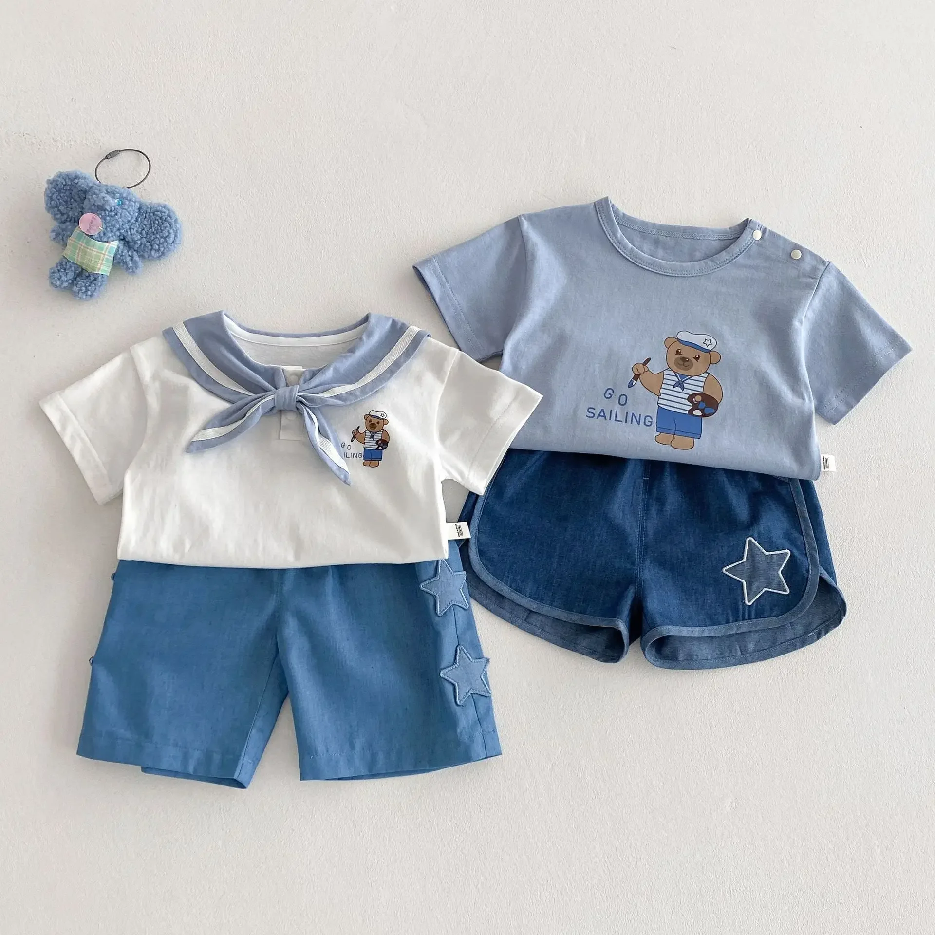 Children's Navy Style T-shirt 2025 New Summer Girls' Teddy Bear Base Shirt Boys' Denim Shorts Baby Summer Outfit
Children's Navy Style T-shirt 2025 New Summer Girls' Teddy Bear Base Shirt Boys' Denim Shorts Baby Summer Outfit