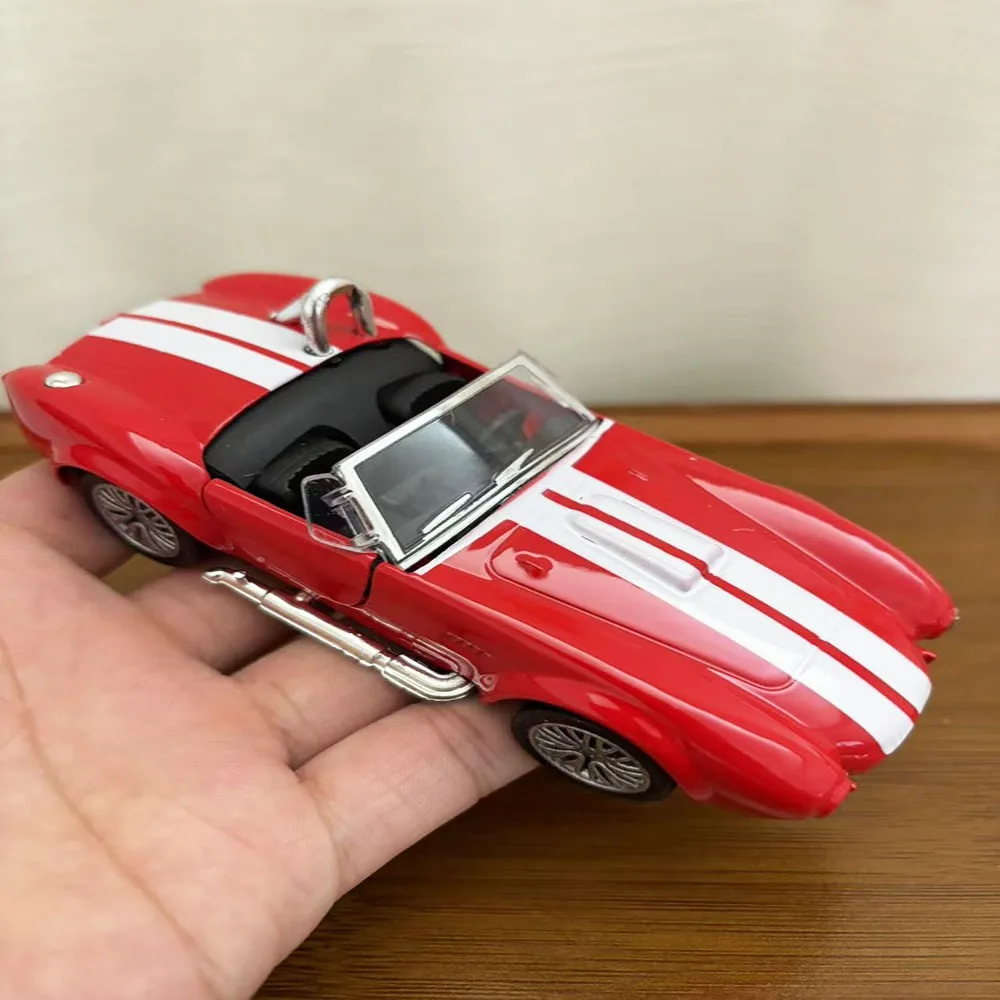 1:32 Cobra 427 Классический винтажный автомобиль, модель автомобиля из сплава, детская игрушечная машинка
1:32 Cobra 427 Классический винтажный автомобиль, модель автомобиля из сплава, детская игрушечная машинка