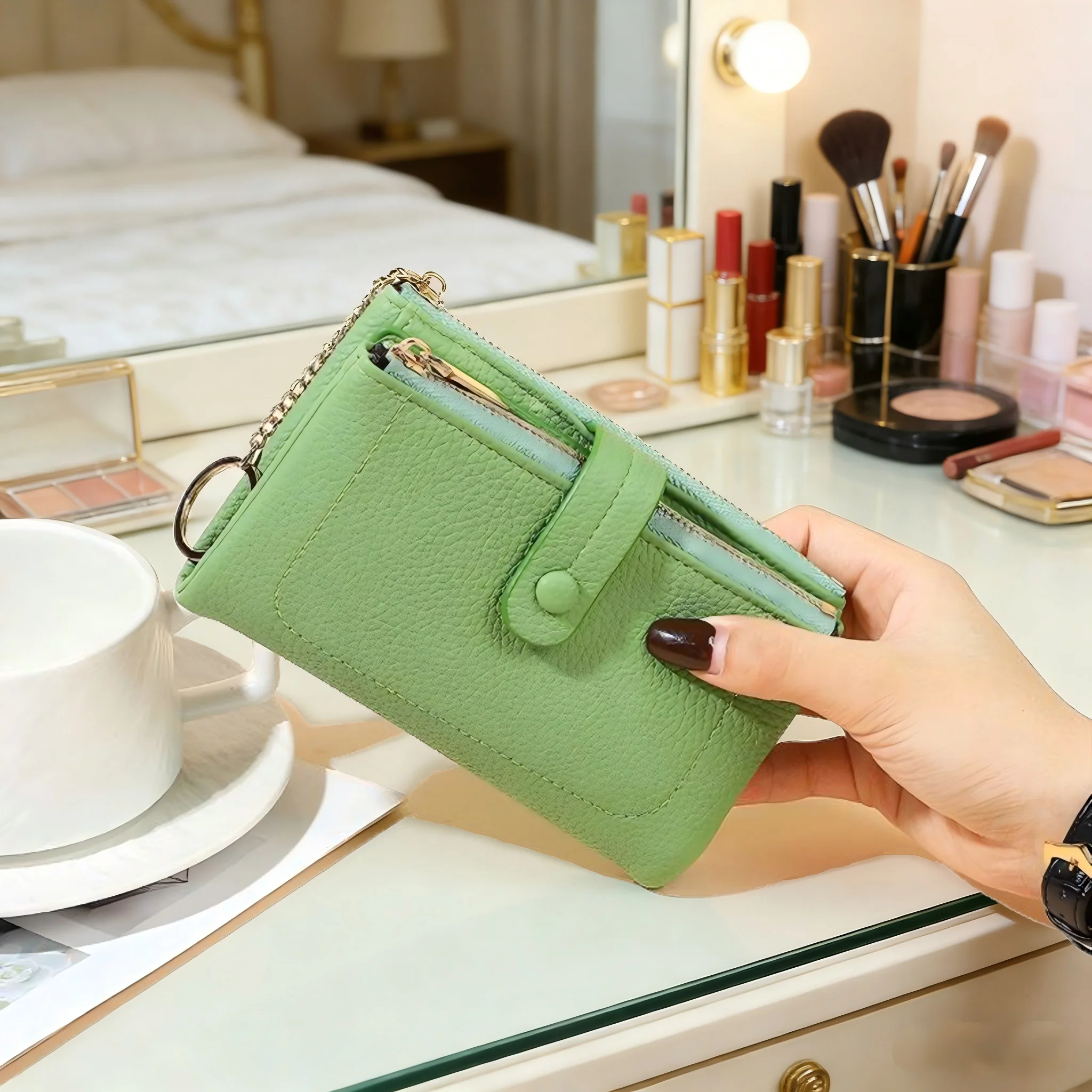 A lady holding a wallet with double zippers, made of lychee-pattern PU soft leather, in a three-fold design, and of medium lengt
A lady holding a wallet with double zippers, made of lychee-pattern PU soft leather, in a three-fold design, and of medium lengt