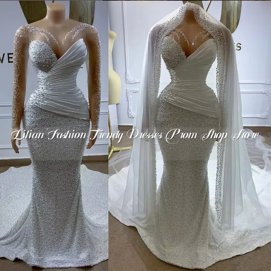 Luxury White Pearl Mermaid Wedding Dress 2025 Elegant Tulle Long Sleeve Bust Pleated Custom Beach Bridal Gowns فساتين سهرة
Luxury White Pearl Mermaid Wedding Dress 2025 Elegant Tulle Long Sleeve Bust Pleated Custom Beach Bridal Gowns فساتين سهرة