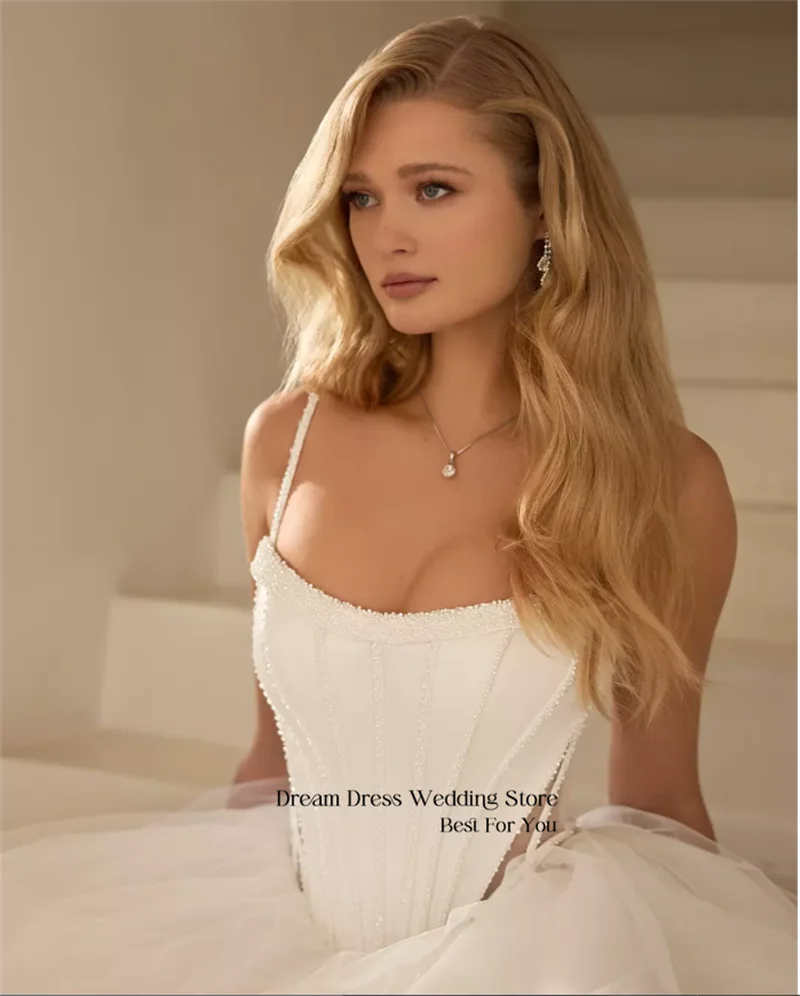 DREAM Customized Romantic Sleeveless Spaghetti Strap Luxurious Pearl Boned Tulle Train Wedding Dress Customizable Bridal Gown
DREAM Customized Romantic Sleeveless Spaghetti Strap Luxurious Pearl Boned Tulle Train Wedding Dress Customizable Bridal Gown