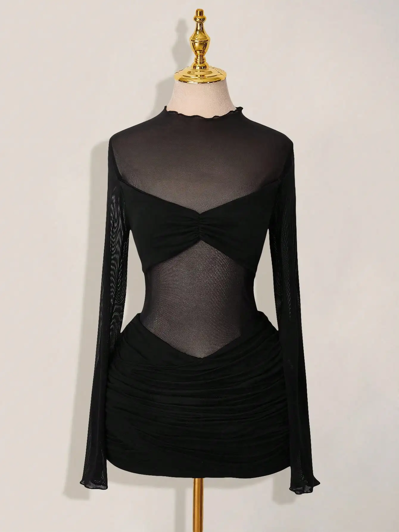 Black Sheer Mesh Ruched Long Sleeve Mini Dress with Cutout Detail
Black Sheer Mesh Ruched Long Sleeve Mini Dress with Cutout Detail