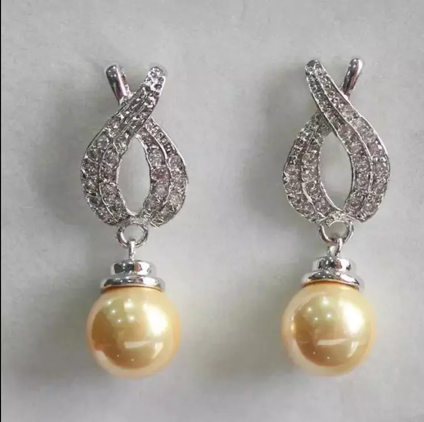 Fashionable feminine temperament yellow Shell Pearl Earrings
Fashionable feminine temperament yellow Shell Pearl Earrings