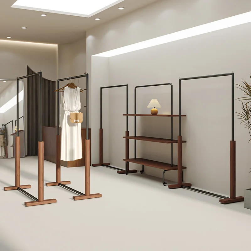 Women's clothing store shelf display rack Floor-to-ceiling black with walnut color hanger Simple clothing store Zhongdao rack
Women's clothing store shelf display rack Floor-to-ceiling black with walnut color hanger Simple clothing store Zhongdao rack