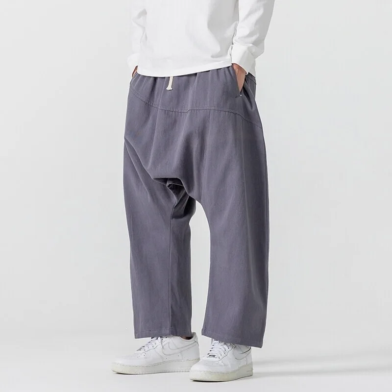 Japanese Hong Kong Style Men Loose Drop Crotch Harem Pants Drawstring Spliced Casual Baggy Trousers Summer Plus Size S 5XL
Japanese Hong Kong Style Men Loose Drop Crotch Harem Pants Drawstring Spliced Casual Baggy Trousers Summer Plus Size S 5XL