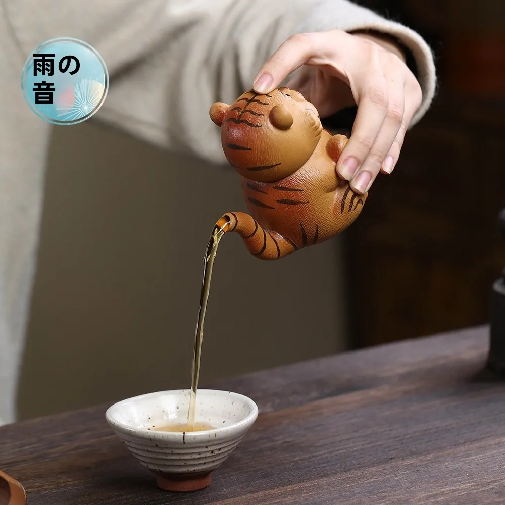 Handmade Purple Clay Tea Pot Cute Tiger Handle Tea Brewing Pot Non-Scalding Tea Set Cartoon Cute Elements from Mainland China
Handmade Purple Clay Tea Pot Cute Tiger Handle Tea Brewing Pot Non-Scalding Tea Set Cartoon Cute Elements from Mainland China