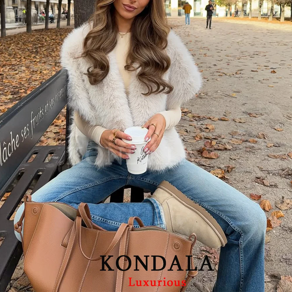 KONDALA шикарные бежевые жилеты из искусственного меха женские куртки без рукавов с v-образным вырезом мода 2025 осень-весна элегантная верхняя одежда для вечеринок
KONDALA шикарные бежевые жилеты из искусственного меха женские куртки без рукавов с v-образным вырезом мода 2025 осень-весна элегантная верхняя одежда для вечеринок