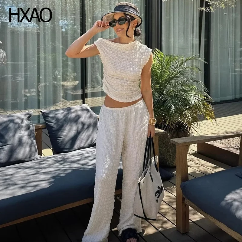 Женский летний костюм HXAO, белая блузка без рукавов и жидкие брюки, комплект из двух предметов в Корейском стиле, элегантный женский комплект
Женский летний костюм HXAO, белая блузка без рукавов и жидкие брюки, комплект из двух предметов в Корейском стиле, элегантный женский комплект