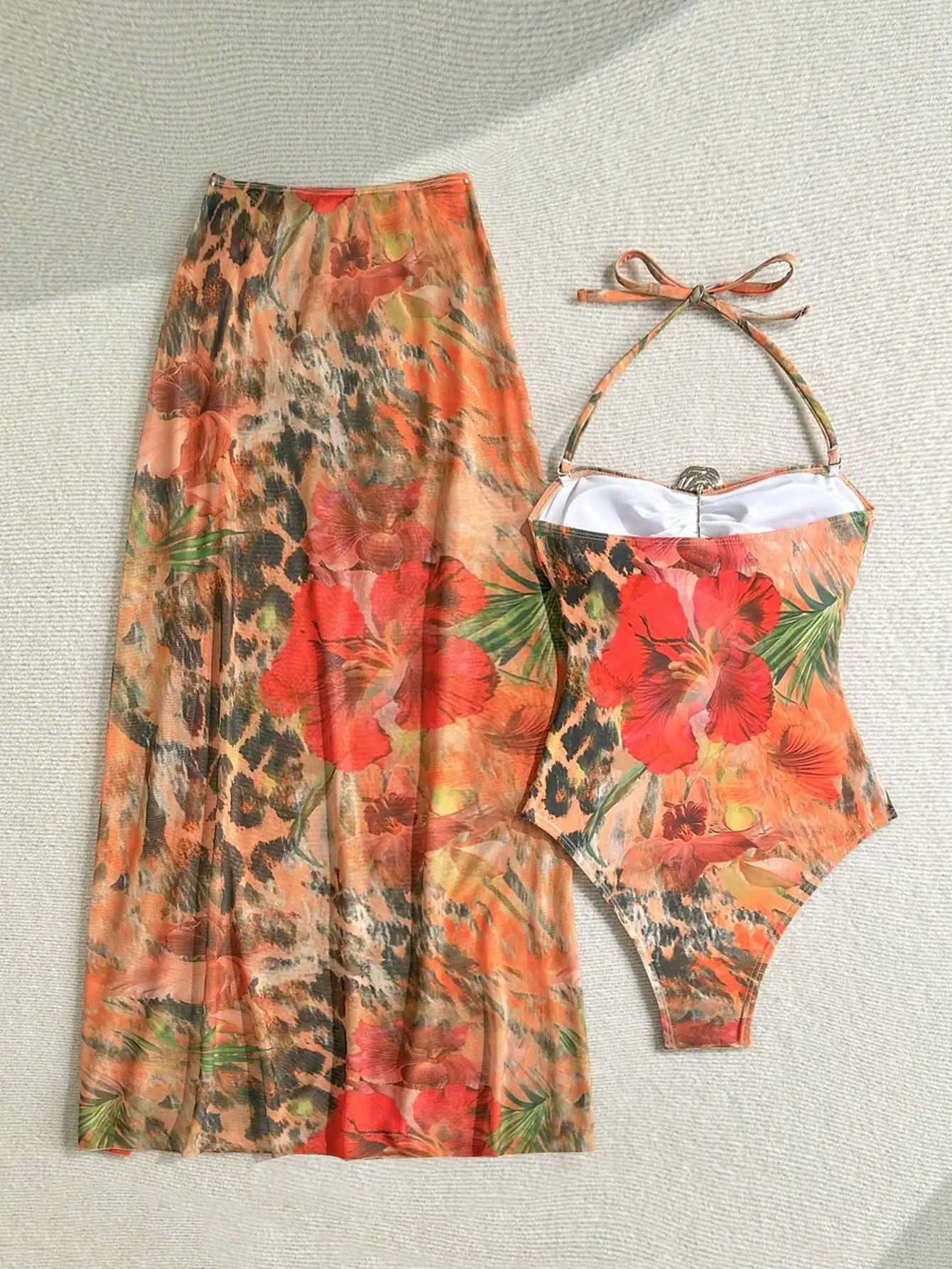 Women Floral Print Halter Swimsuit With Matching Cover Up Skirt Set
Women Floral Print Halter Swimsuit With Matching Cover Up Skirt Set