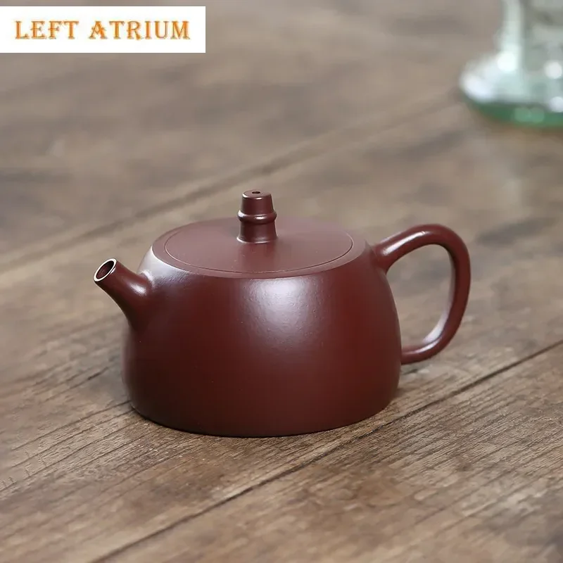 170ml Yixing Purple Clay Teapot Famous Handmade Ball Hole Filter Tea Pot Raw Ore Purple Zhu Mud Kettle Chinese Zisha Tea Set
170ml Yixing Purple Clay Teapot Famous Handmade Ball Hole Filter Tea Pot Raw Ore Purple Zhu Mud Kettle Chinese Zisha Tea Set