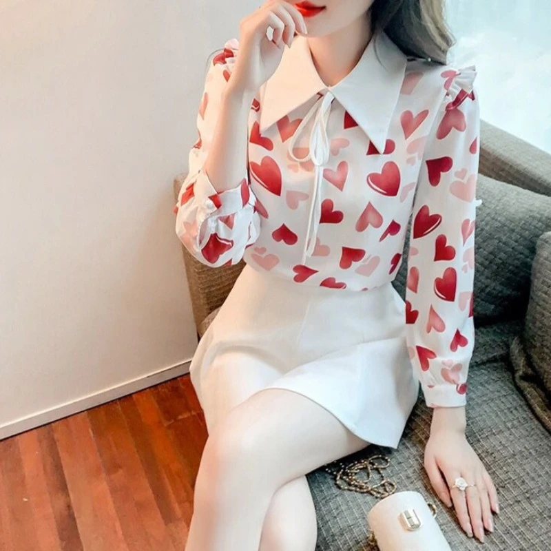 Женская блузка свободного кроя с воротником «Питер Пэн», цветочным принтом, в корейском стиле, с длинным рукавом, весна 2026
Женская блузка свободного кроя с воротником «Питер Пэн», цветочным принтом, в корейском стиле, с длинным рукавом, весна 2026