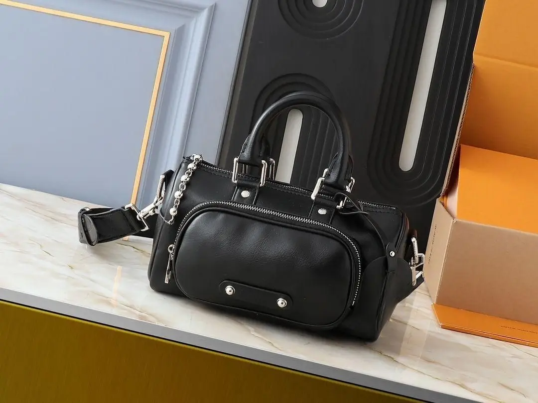 Vintage black leather bowling tote bag, retro-style mini Boston bag
Vintage black leather bowling tote bag, retro-style mini Boston bag