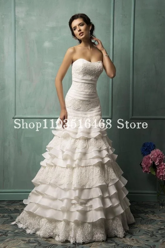 History Victorian White Wedding Dresses Sweetheart Sheath Lace Applique Skinny Mermaid Ruffle فساتين حفلة موسيقية Customised
History Victorian White Wedding Dresses Sweetheart Sheath Lace Applique Skinny Mermaid Ruffle فساتين حفلة موسيقية Customised