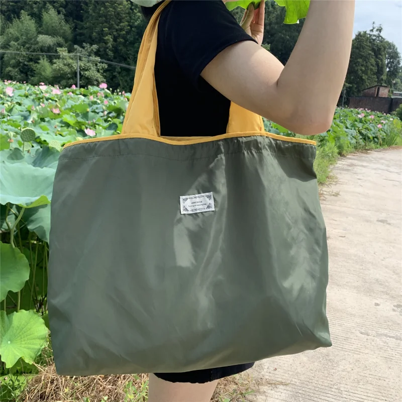 Popular polyester foldable reusable shopping bag portable carrying storage bag oversized single shoulder grocery bag
Popular polyester foldable reusable shopping bag portable carrying storage bag oversized single shoulder grocery bag