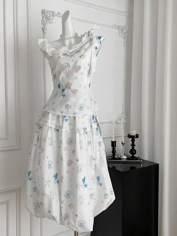 Летние женские винтажные бежевые бандажные топы без рукавов с принтом и бантом + длинная юбка трапециевидной формы с высокой талией и оборками для отпуска, комплект из двух предметов в стиле бохо 
Летние женские винтажные бежевые бандажные топы без рукавов с принтом и бантом + длинная юбка трапециевидной формы с высокой талией и оборками для отпуска, комплект из двух предметов в стиле бохо