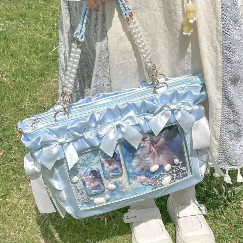 Милая сумка Y2K Ita с рюшами и бантиками, сумка на плечо в стиле Лолиты для девочек, большая вместительная сумка в консервативном стиле, прозрачная женская сумка в стиле Харадзюку
Милая сумка Y2K Ita с рюшами и бантиками, сумка на плечо в стиле Лолиты для девочек, большая вместительная сумка в консервативном стиле, прозрачная женская сумка в стиле Харадзюку