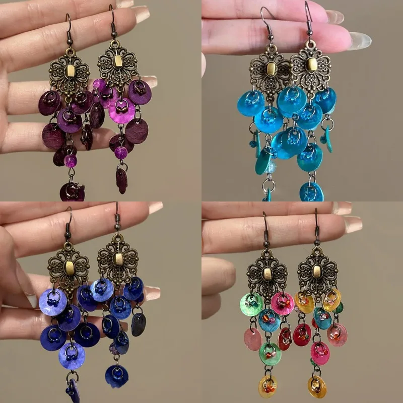 Ethnic Style Round Shell Tassel Earrings for Women Retro Bronze Plated Hollow Flower Long Earring Dangle Female Party Jewelry
Ethnic Style Round Shell Tassel Earrings for Women Retro Bronze Plated Hollow Flower Long Earring Dangle Female Party Jewelry