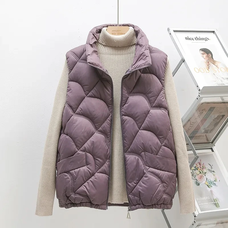 Lightweight Down Vest Jacket Women's 2025 Autumn Winter New Stand collar Female Casual Sleeveless Short Down Waistcoat Tops
Lightweight Down Vest Jacket Women's 2025 Autumn Winter New Stand collar Female Casual Sleeveless Short Down Waistcoat Tops