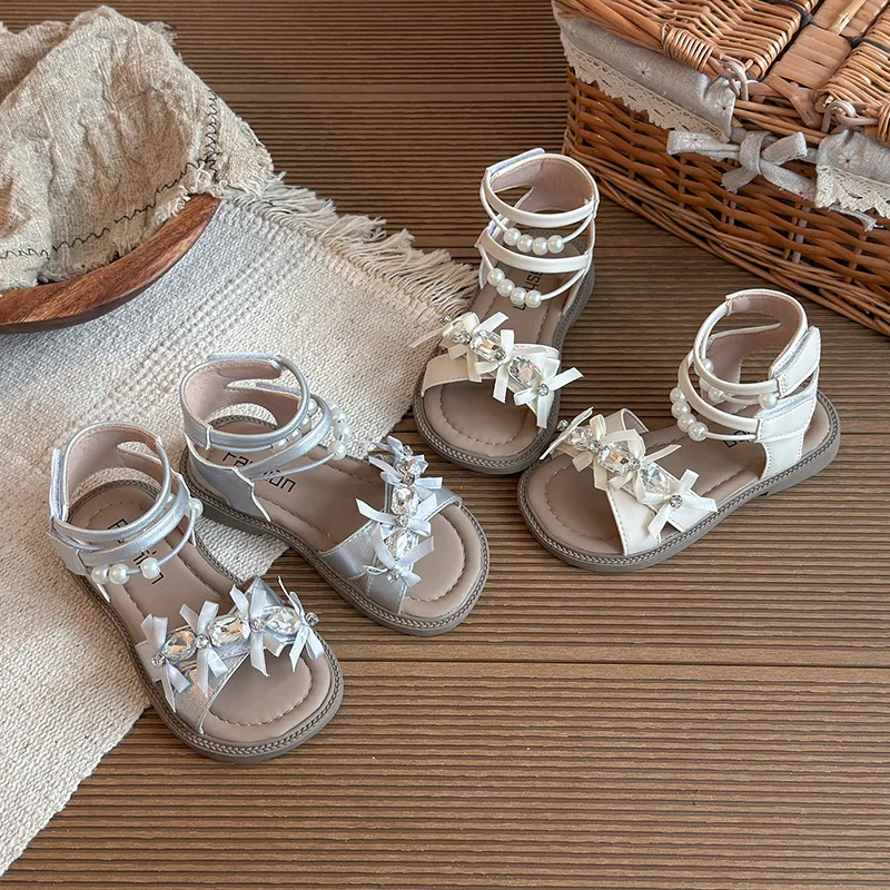 Mumoresip Girls Roman Shoes Elegant Pearl Children Sandals Korean Style Versatile 2026 Summer Kids Princess Shoes Soft Bottom
Mumoresip Girls Roman Shoes Elegant Pearl Children Sandals Korean Style Versatile 2026 Summer Kids Princess Shoes Soft Bottom