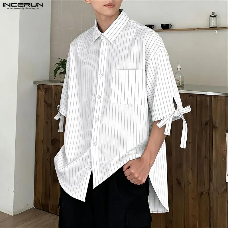 INCERUN Мужская полосатая рубашка с лацканами и половиной рукава, свободная мужская одежда на шнуровке, уличная одежда, модные повседневные мужские рубашки в корейском стиле, S-5XL
INCERUN Мужская полосатая рубашка с лацканами и половиной рукава, свободная мужская одежда на шнуровке, уличная одежда, модные повседневные мужские рубашки в корейском стиле, S-5XL