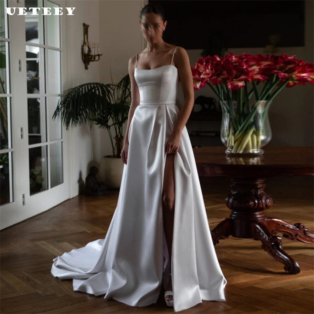 UETEEY Customized Simple Spaghetti Straps Satin Wedding Dress Elegant High Side Slit Floor Length Court Train Bridal Gown
UETEEY Customized Simple Spaghetti Straps Satin Wedding Dress Elegant High Side Slit Floor Length Court Train Bridal Gown