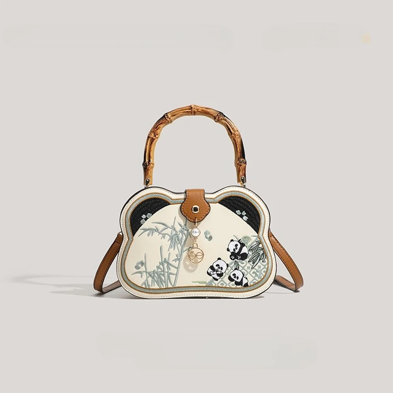 New Chinese style bamboo knot handbag for women 2026, versatile and cute cartoon panda single shoulder crossbody handbag
New Chinese style bamboo knot handbag for women 2026, versatile and cute cartoon panda single shoulder crossbody handbag