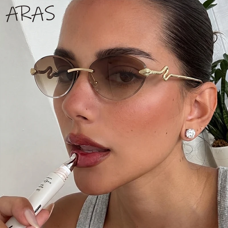 Oval Photochromic Vintage Rimless Snake Sunglasses Women 2026 Luxury Designer Y2K Retro Metal Frame Shades Punk Cut Edge Eyewear
Oval Photochromic Vintage Rimless Snake Sunglasses Women 2026 Luxury Designer Y2K Retro Metal Frame Shades Punk Cut Edge Eyewear