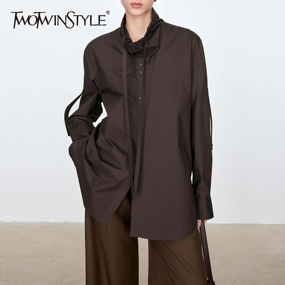 TWOTWINSTYLE Solid Patchwork Lace Up Loose Blouse For Women Stand Neck Long Sleeve Temperament Casual Shirts Female Fashion New
TWOTWINSTYLE Solid Patchwork Lace Up Loose Blouse For Women Stand Neck Long Sleeve Temperament Casual Shirts Female Fashion New