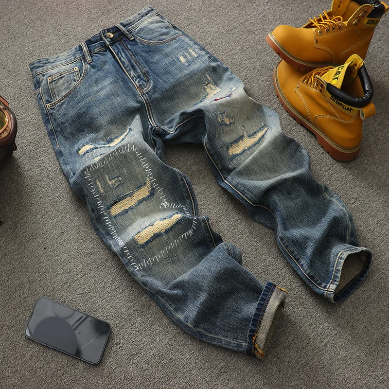 Trendy American retro ripped patch loose straight leg jeans for men, fashionable streetwear, cool and nostalgic pants
Trendy American retro ripped patch loose straight leg jeans for men, fashionable streetwear, cool and nostalgic pants