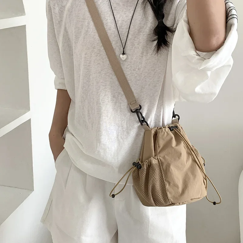 Summer Drawstring Bucket Bags Nylon Canvas Shoulder Crossbody Bags For Women Travel Shopper Handbags Lightweight Small Bags
Summer Drawstring Bucket Bags Nylon Canvas Shoulder Crossbody Bags For Women Travel Shopper Handbags Lightweight Small Bags