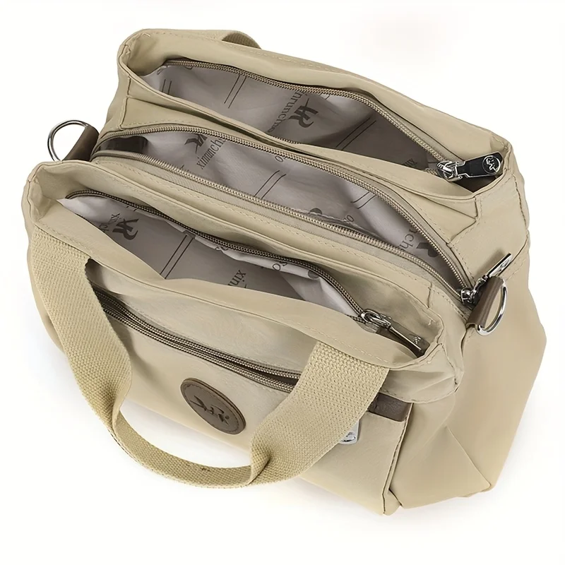 Легкая нейлоновая сумка через плечо, несколько карманов, застежка-молния. Регулируемый ремень, полиэстеровая подкладка. Идеальная дорожная сумка через плечо для женщин.
Легкая нейлоновая сумка через плечо, несколько карманов, застежка-молния. Регулируемый ремень, полиэстеровая подкладка. Идеальная дорожная сумка через плечо для женщин.