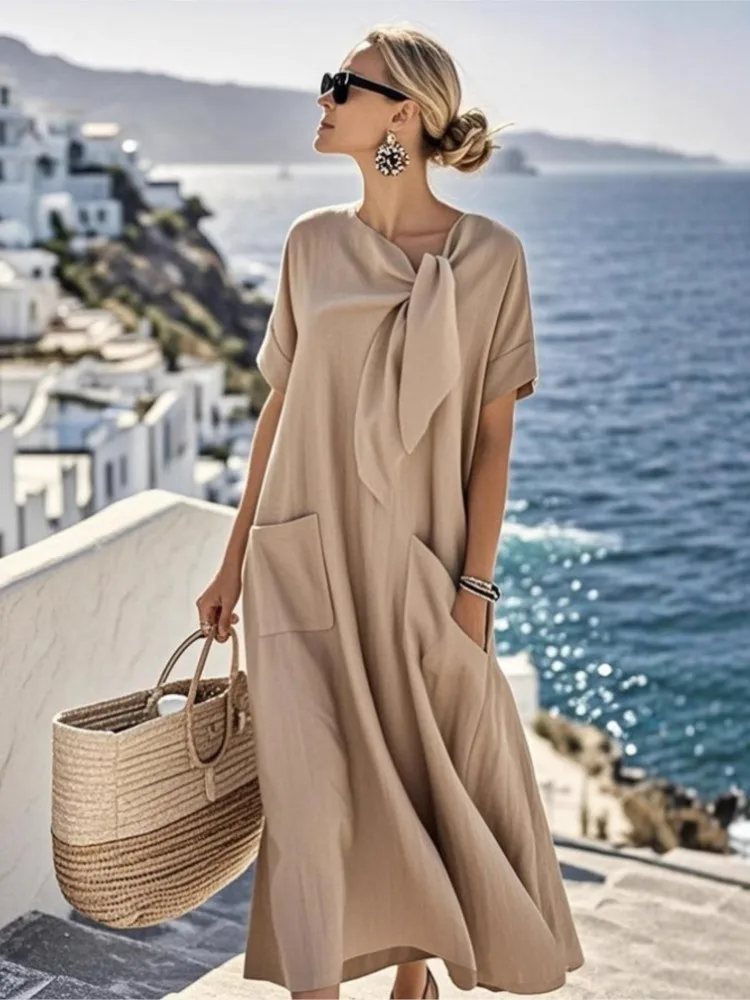 Элегантное свободное платье с короткими рукавами и карманами с бантом и широким подолом для женщин, летние модные новые однотонные повседневные платья Robe Femme
Элегантное свободное платье с короткими рукавами и карманами с бантом и широким подолом для женщин, летние модные новые однотонные повседневные платья Robe Femme