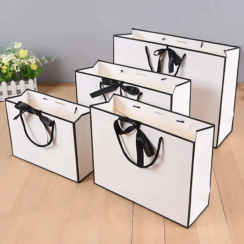 2pcs White Fashionable Shopping Tote Bag Gift Packaging White Paper Box Black Border Handbag Bow Banquet Multi-purpose Gift Bag
2pcs White Fashionable Shopping Tote Bag Gift Packaging White Paper Box Black Border Handbag Bow Banquet Multi-purpose Gift Bag
