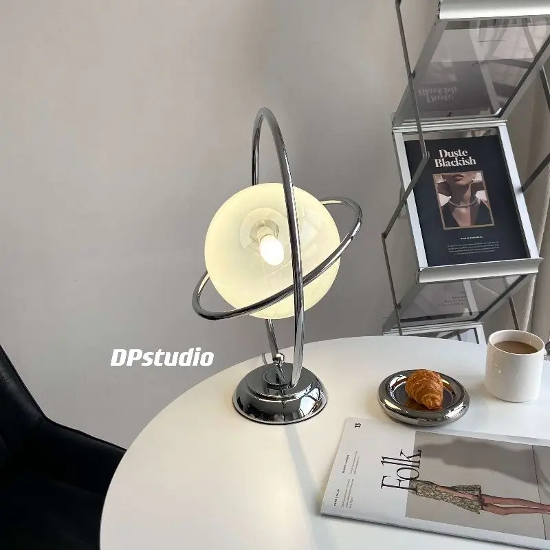 Italian minimalist planet table lamp rotatable vintage designer glass Saturn decorative lamp
Italian minimalist planet table lamp rotatable vintage designer glass Saturn decorative lamp