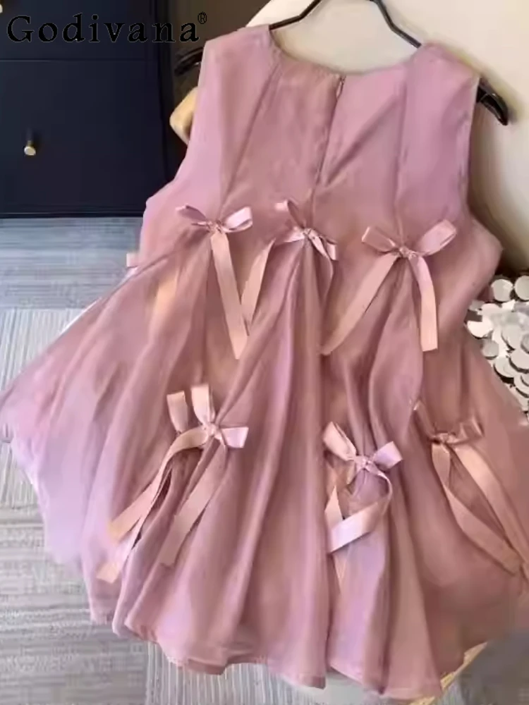 Большой размер, однотонная рубашка без рукавов с французским милым бантом, летние свободные рубашки с круглым вырезом для девочек, модные универсальные рубашки для снижения возраста 
Большой размер, однотонная рубашка без рукавов с французским милым бантом, летние свободные рубашки с круглым вырезом для девочек, модные универсальные рубашки для снижения возраста