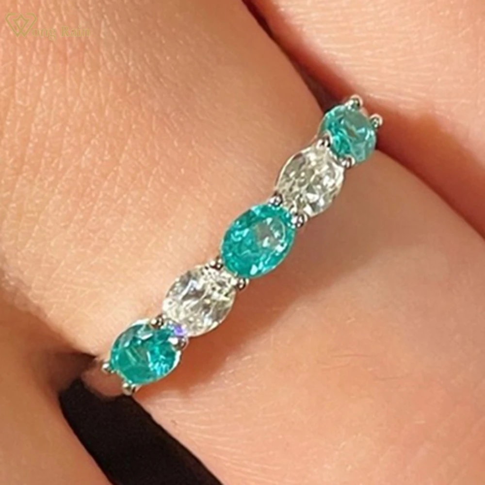 Wong Rain Classic 925 Sterling Silver Oval Cut Paraiba Tourmaline Gems High Carbon Diamond Row Ring Fine Jewelry Wedding Band
Wong Rain Classic 925 Sterling Silver Oval Cut Paraiba Tourmaline Gems High Carbon Diamond Row Ring Fine Jewelry Wedding Band