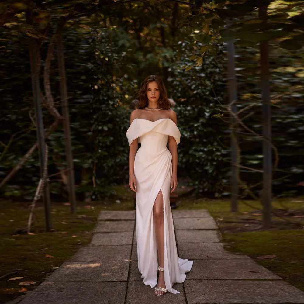 Новейшее свадебное платье-футляр из атласа с вырезом лодочкой по индивидуальному заказу и разрезом на ноге с открытыми плечами Vestidos De Novias
Новейшее свадебное платье-футляр из атласа с вырезом лодочкой по индивидуальному заказу и разрезом на ноге с открытыми плечами Vestidos De Novias