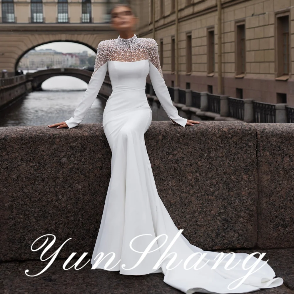 YunShang Customized Elegant High Neck Long Sleeve Sheath Wedding Dress with Intricate Pearl Embellished Mesh Yoke and Graceful
YunShang Customized Elegant High Neck Long Sleeve Sheath Wedding Dress with Intricate Pearl Embellished Mesh Yoke and Graceful