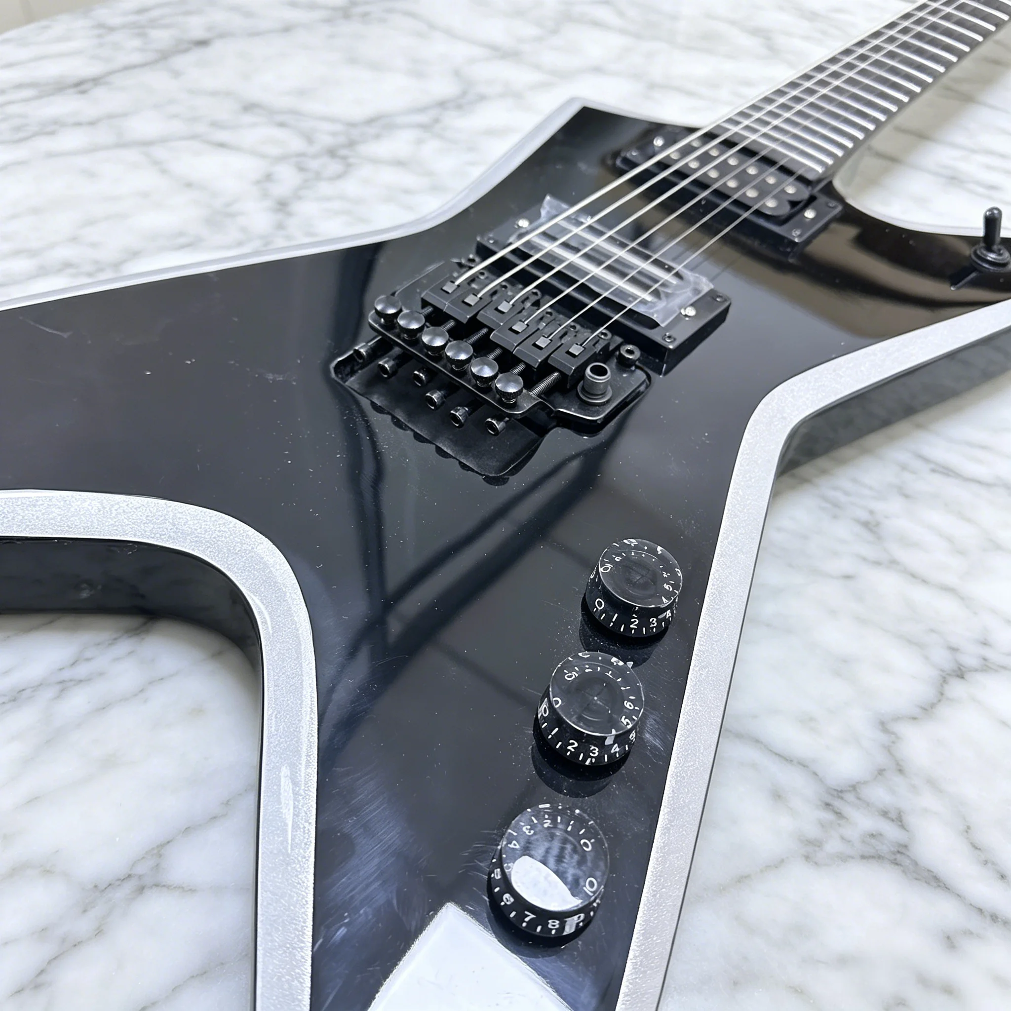 Black V-Shaped Electric Guitar Silver Beveled Edge Heavy Metal Style HH Humbuckers Glossy Black Finish Free Shipping Worldwide
Black V-Shaped Electric Guitar Silver Beveled Edge Heavy Metal Style HH Humbuckers Glossy Black Finish Free Shipping Worldwide