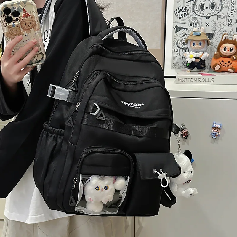 Minimalist Black Backpack For Unisex Durable Casual Rucksack With Plush Charm & Buckle Detail
Minimalist Black Backpack For Unisex Durable Casual Rucksack With Plush Charm & Buckle Detail
